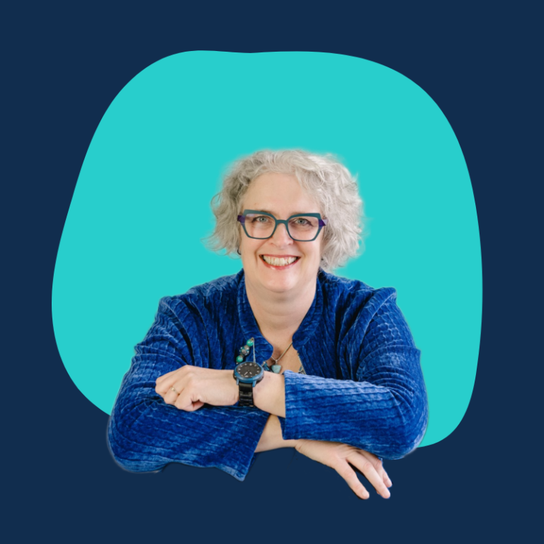 Person with short gray hair, teal background